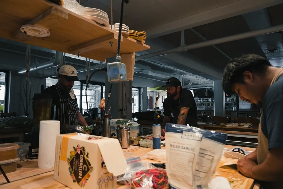 Chefs prepping at the kitchen counter
